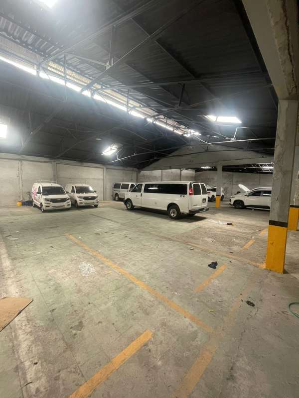 Indoor parking garage with multiple vans inside warehouse commercial property Panama