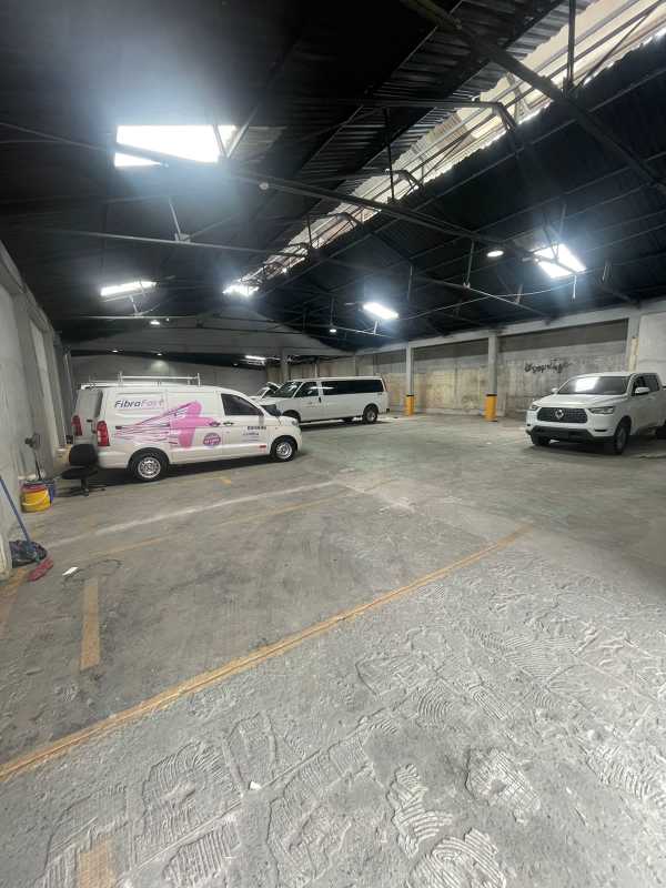 Warehouse parking garage with trucks and skylights interior Panama City