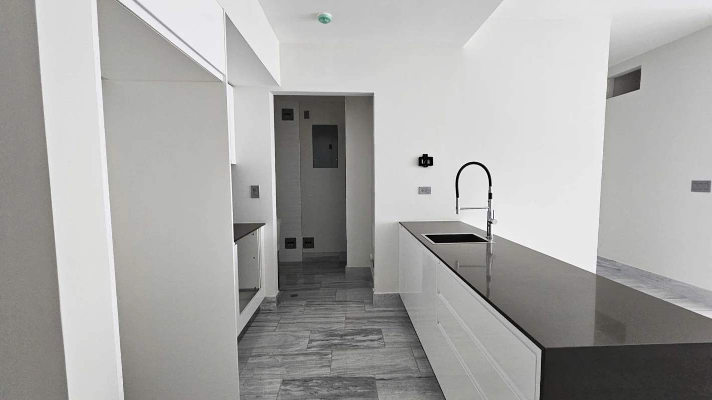 Modern Italian kitchen with marble countertops appliance package at Nuovo by Armani Casa in Panama