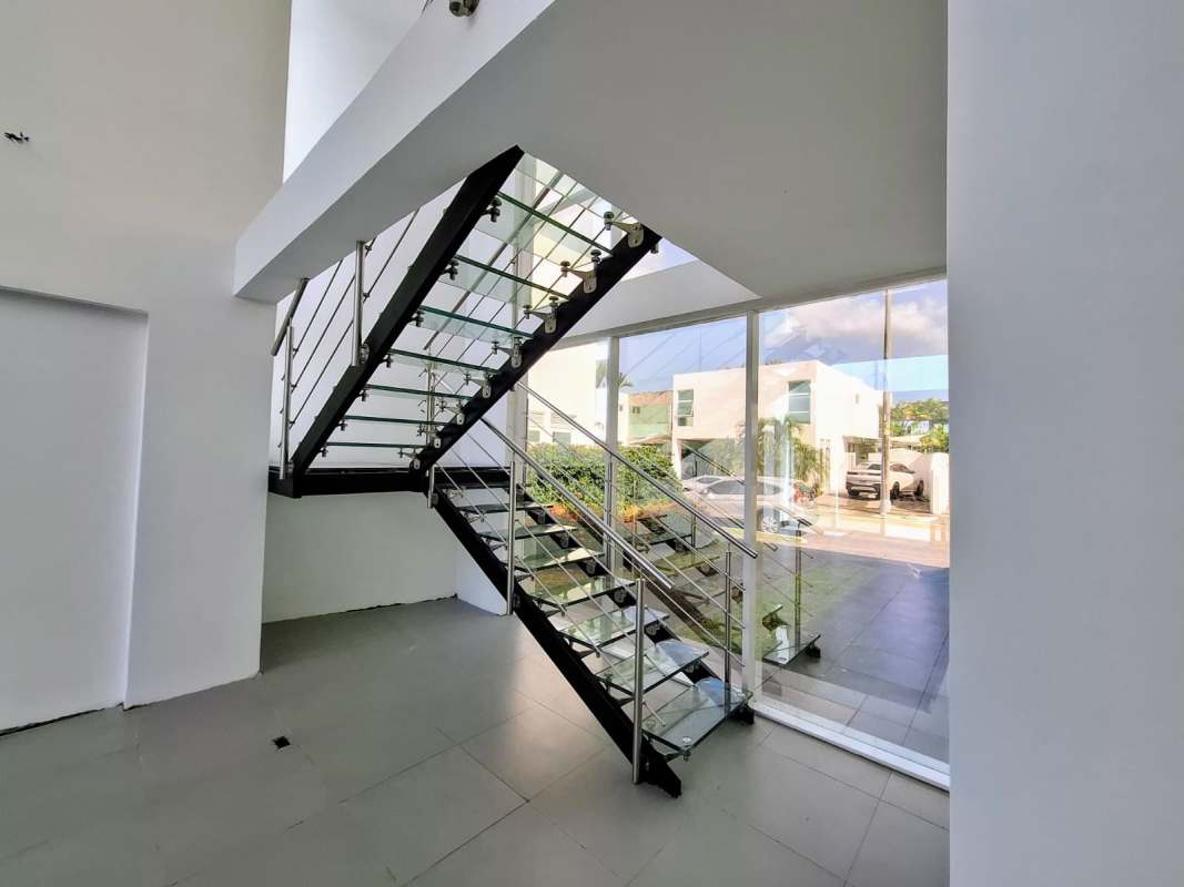 Spacious living area with floor-to-ceiling windows double height ceilings PH Costa Esmeralda Costa Sur Panama