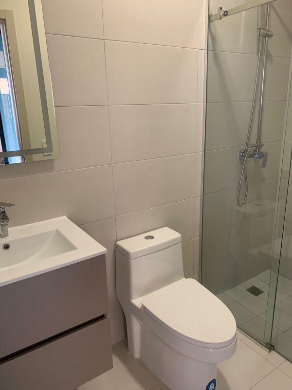 Bright living and dining space with panoramic windows at PH Arcadia Costa del Este Panama