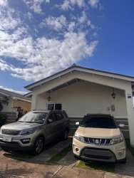 Bright living area with porcelain tile, AC, white sectional sofa in Playa Dorada Villa Marina II Panama