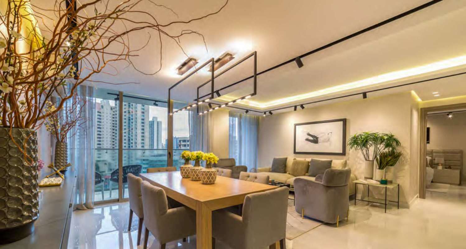 Spacious living dining area with floor-to-ceiling glass and skyline view PH El Cangrejo