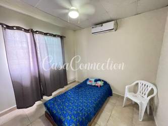 Bedroom with AC, ceiling fan and closet in furnished duplex house for rent David Panama