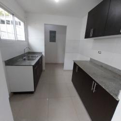 Modern kitchen with granite countertops and dark cabinetry in house for rent Vista Alegre Panama