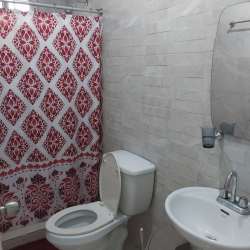 Bright bedroom with tiled floor, window and built-in closet in Brisas del Campo Panama