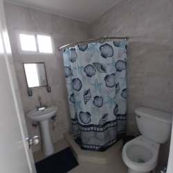 Spacious living and dining area with tiled floors and natural lighting in house for rent Panama