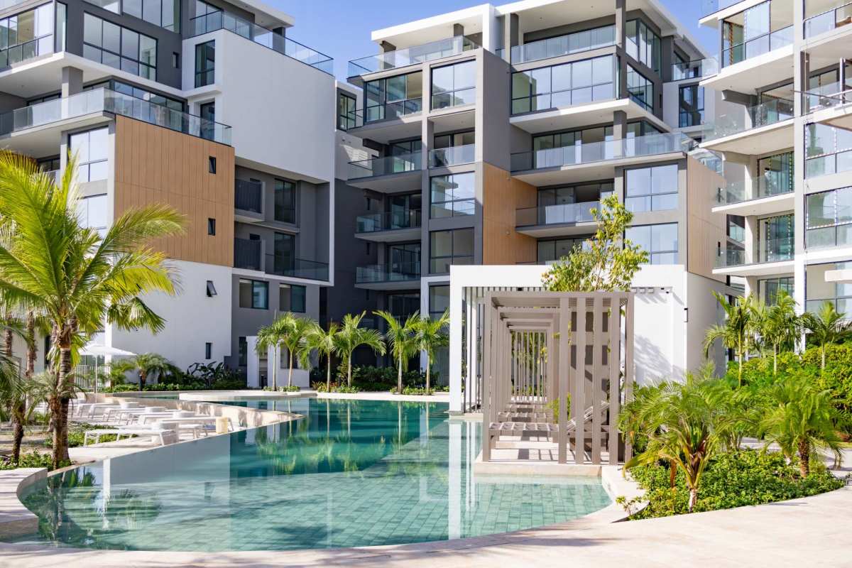 Bright living room with floor-to-ceiling windows and ocean marina views at Ocean Reef Islands Panama