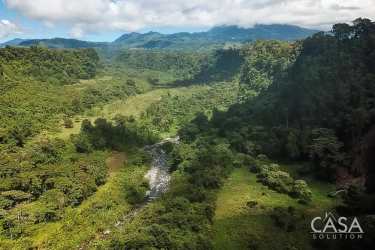 Green mountain canyon with river running through valley in Boquerón Panama