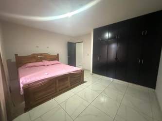Bedroom with tiled floors, closet and natural light in David Chiriquí gated community house
