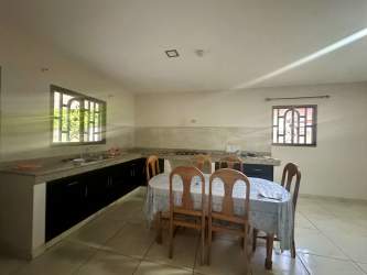 Terrace overlooking garden in fenced yard of house for sale David Chiriquí Panama