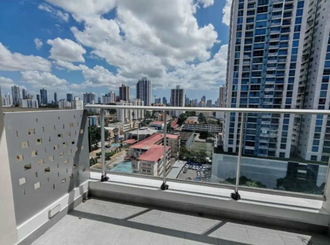 Kitchen with breakfast bar, white cabinets, stainless refrigerator PH Park Square Panama City
