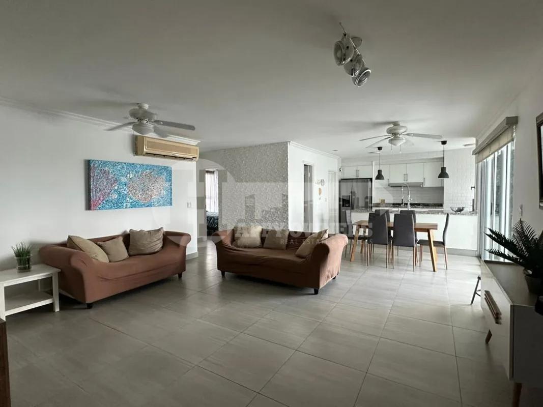 Bathroom with glass shower enclosure, vessel sink, granite counter in PH Moon Tower Coco del Mar