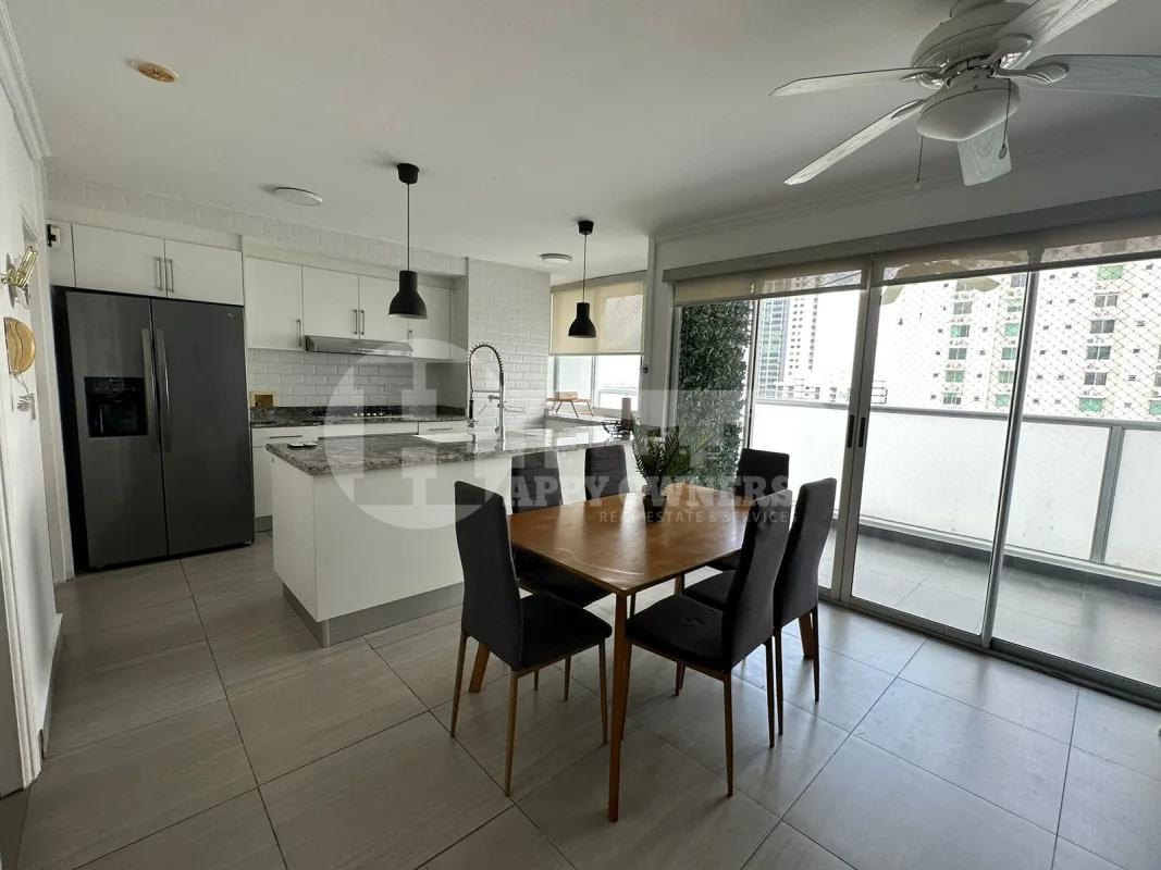 Open kitchen with granite countertops, cabinets, appliances in PH Moon Tower Coco del Mar Panama City