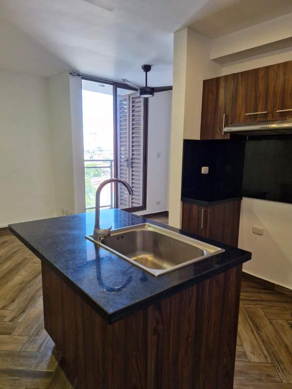 Bedroom with large window, built-in closet, split AC and modern flooring at PH Mirador Panama City