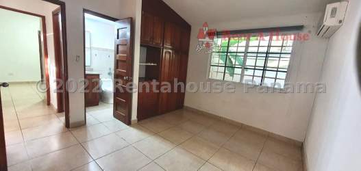 Spacious living area with tile floors, double-height ceiling and natural light in Hill Top Arraiján Panama