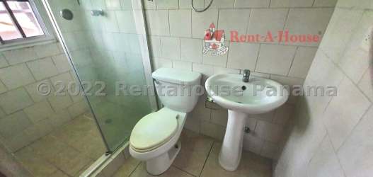 Spacious kitchen with granite countertops, tile backsplash, oven and wooden cabinetry in Hill Top Arraiján