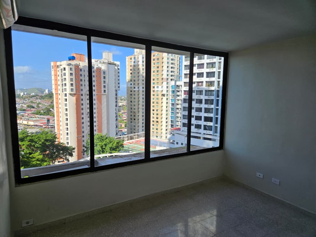 Spacious living room with floor-to-ceiling windows and city view in PH Pacific Hills Dos Mares