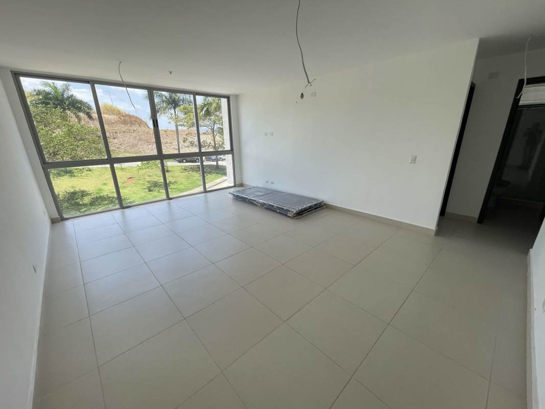 Unfurnished living room with large windows and tiled floors in PH Altaterra El Crisol Villa Lucre Panama