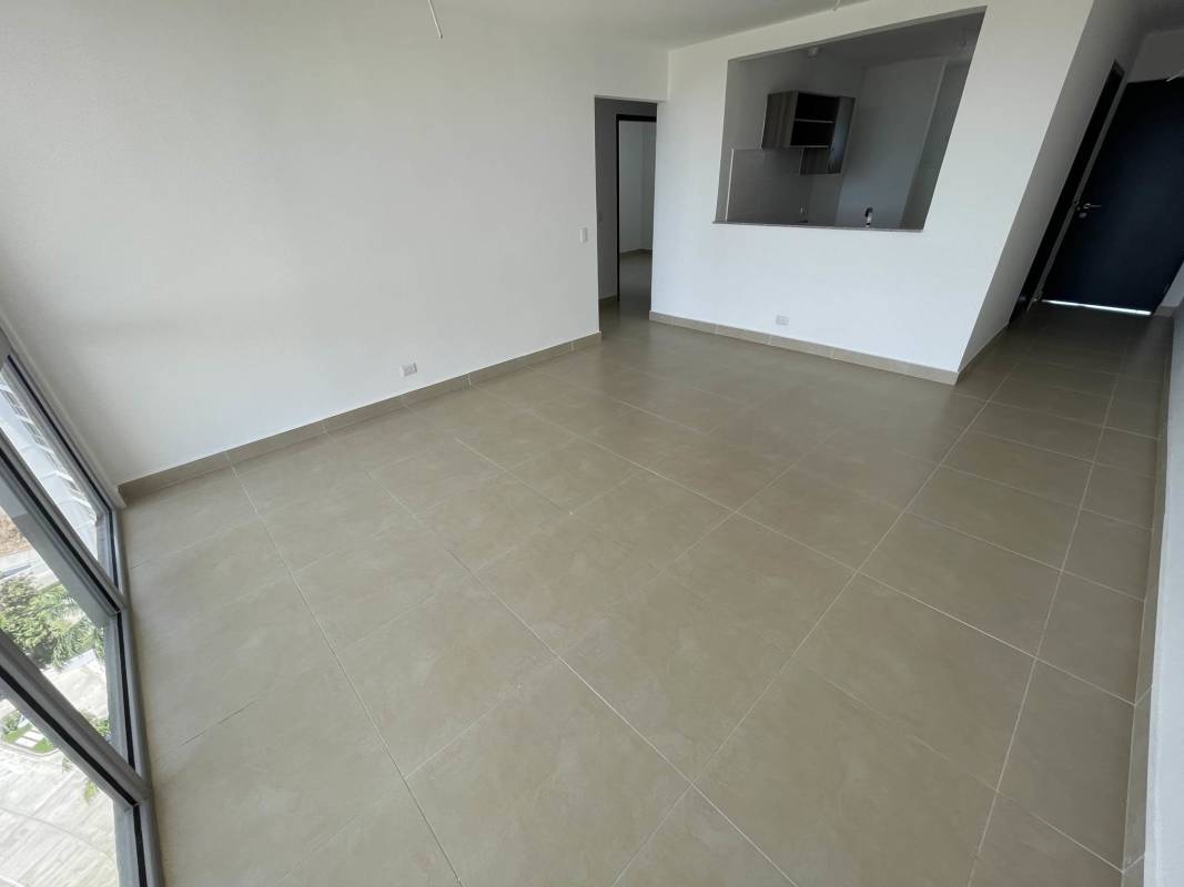 Open concept kitchen granite counters view to city large windows PH Altaterra Panama