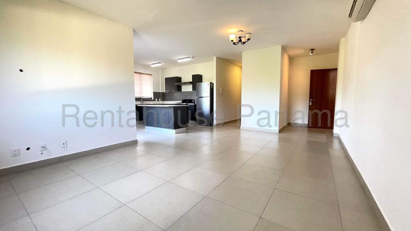 Spacious living and dining area with large windows at River Valley Panama Pacifico apartment for sale