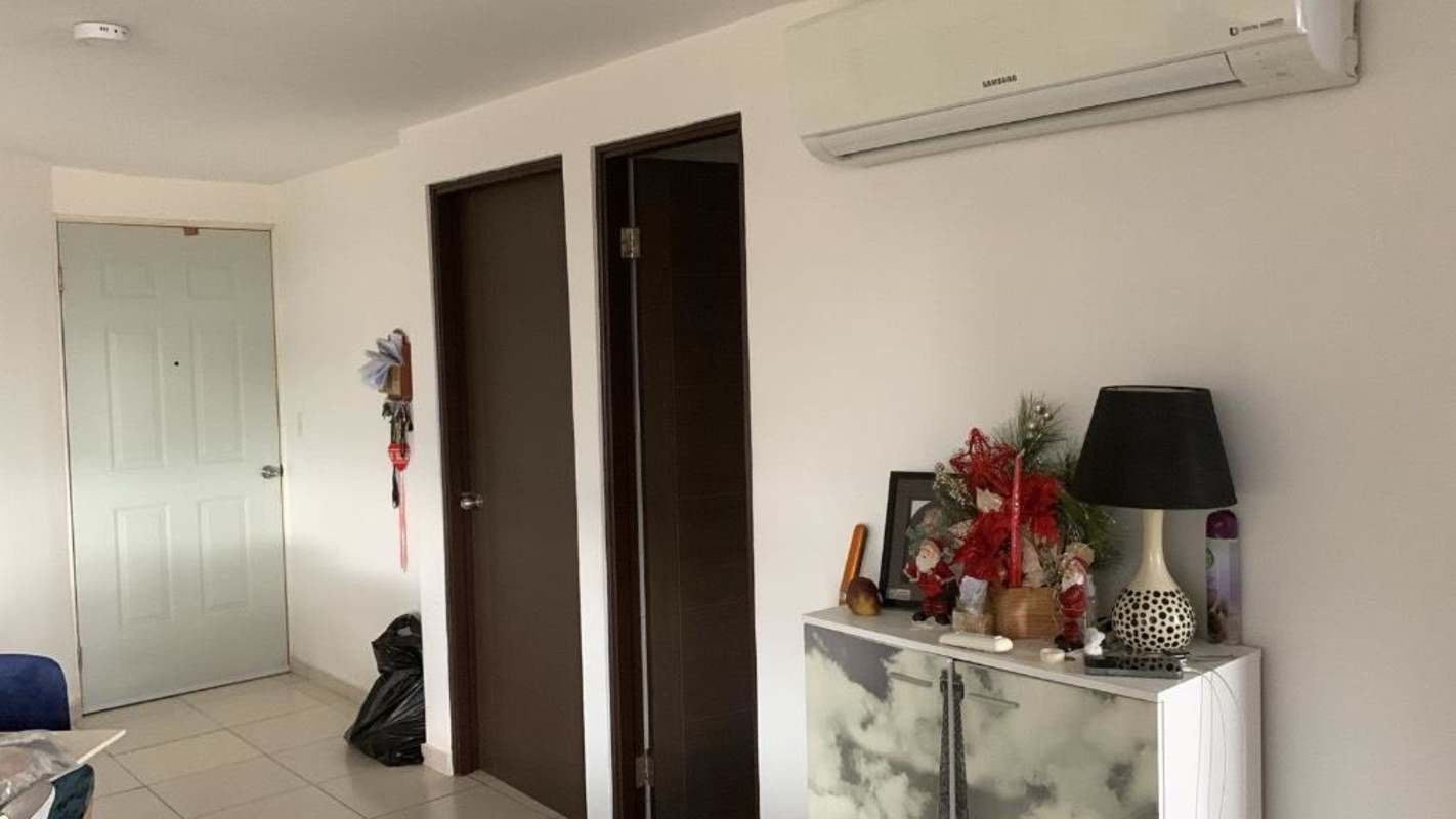 Apartment entrance hallway with AC, modern decor at Torres de Llano Bonito Panama
