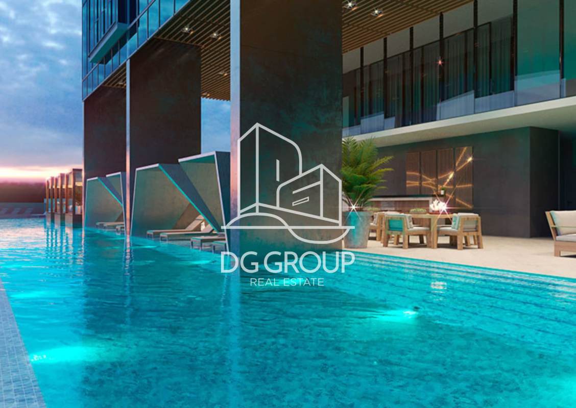 Night view of illuminated swimming pool and cabanas at PH Generation Tower Costa del Este Panama