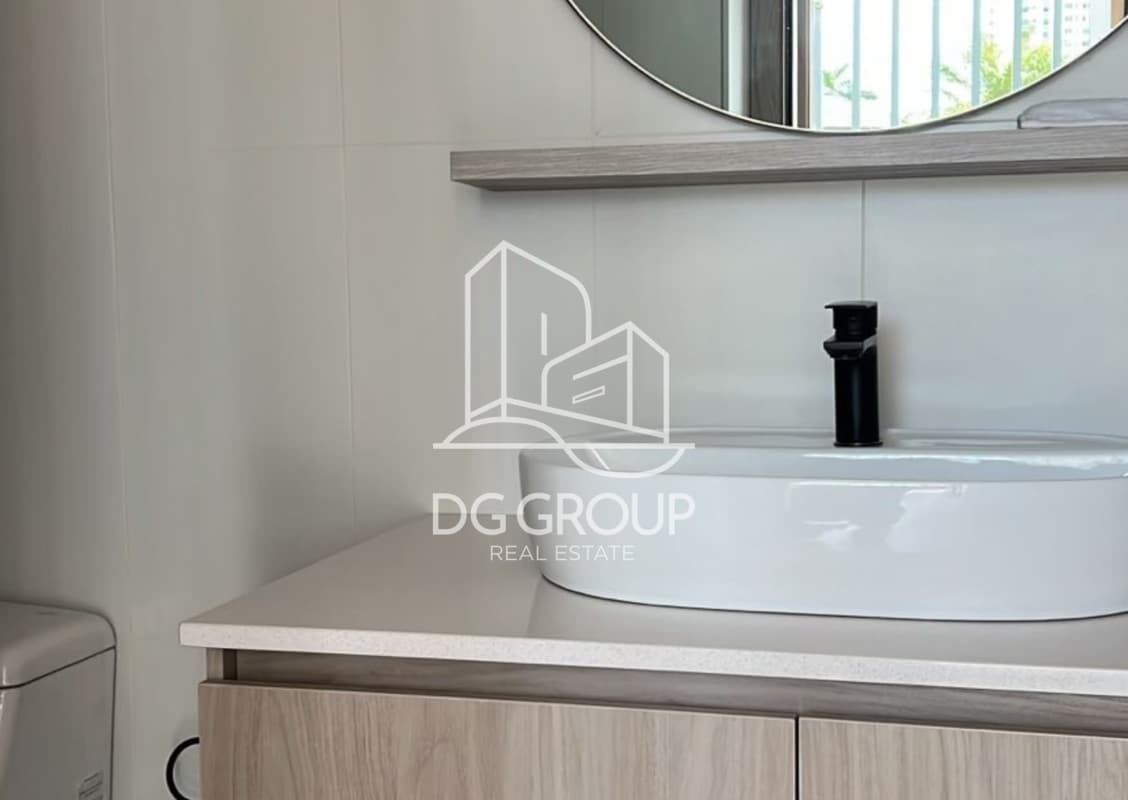 Floating wood vanity with mirror and modern sink at PH Generation Tower Costa del Este Panama