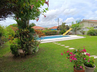 Mediterranean tiled roof, front garden, white walls in Paseo del Rio Penonomé