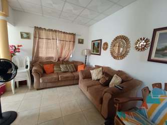 Laundry room with washer, dryer, shelving Penonomé house for sale