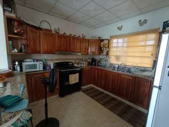 Living room with sofas, mirrors, tiled floor in Barriada Paseo del Rio Penonomé Panama