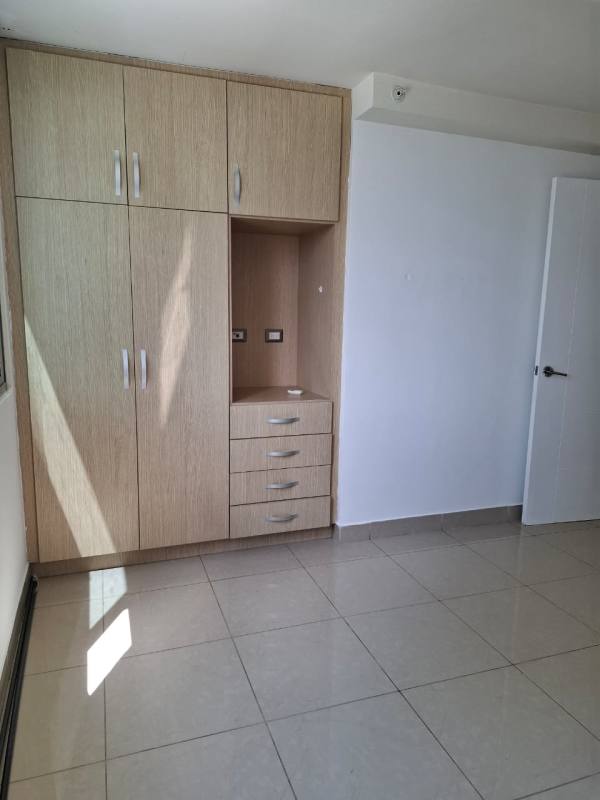 Living room with large sliding doors to balcony and ceramic tile floors in PH Rokas Panama