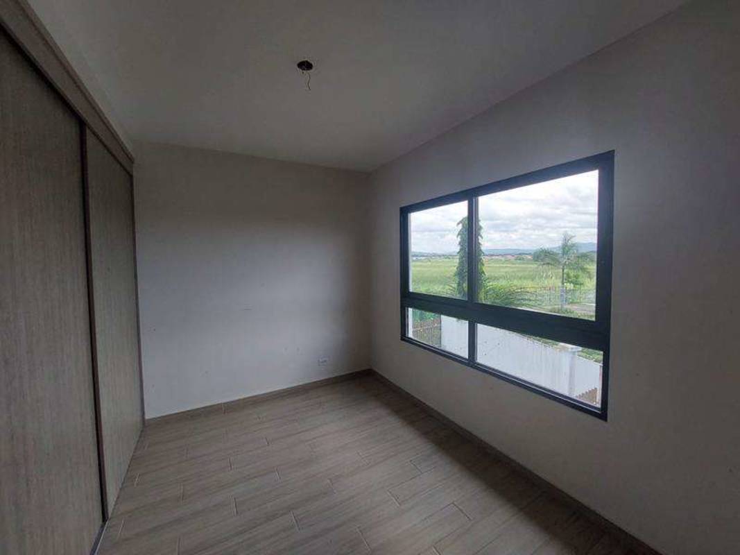 Bright living and dining space with sliding doors opening to terrace in Costa Sur house Panama