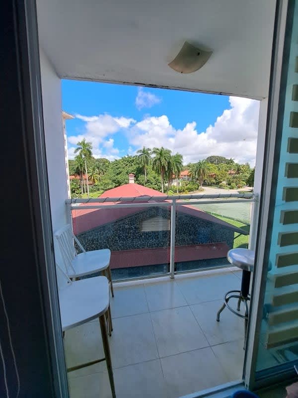 Balcony with glass railing overlooking tropical landscape from PH Albrook Residence Clayton Panama