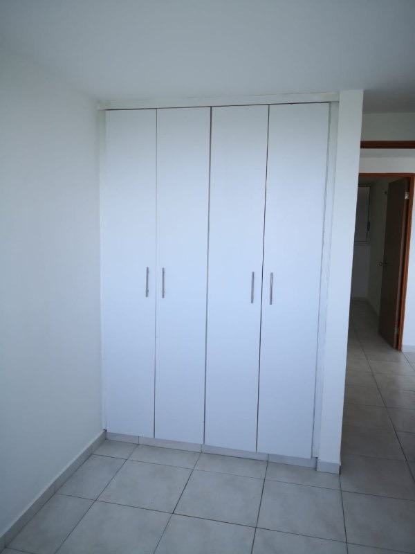 Compact kitchen with granite countertop and cabinets PH Residencial Llano Bonito Panama