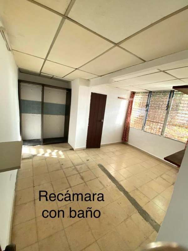 Unfurnished bedroom with tile floor, large window with bars, near Metro Pueblo Nuevo Panama