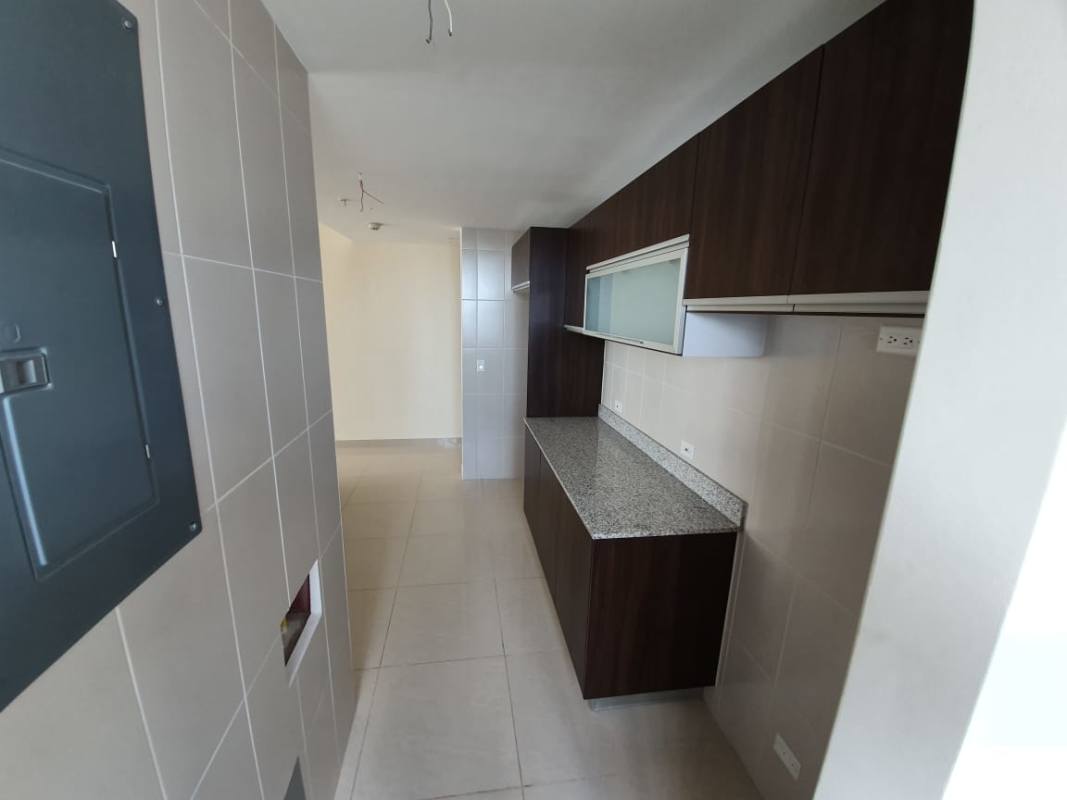 Bedroom featuring large windows and neutral decor in PH San Francisco Skyline Panama City apartment