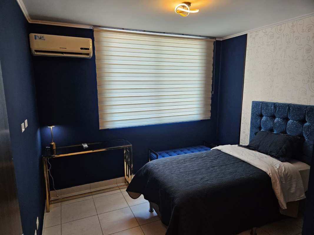 Furnished bedroom with large window air conditioning and closet in PH Miro El Cangrejo Panama