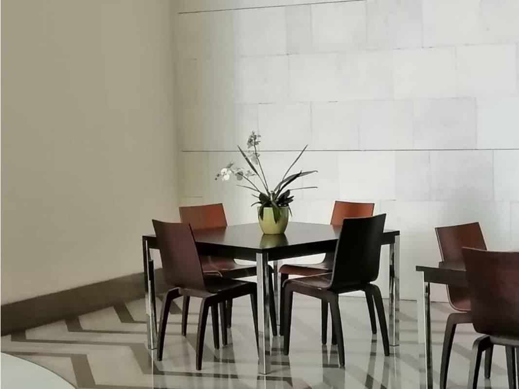 Sophisticated dining room with ocean backdrop, floor-to-ceiling windows in Punta Pacifica Panama