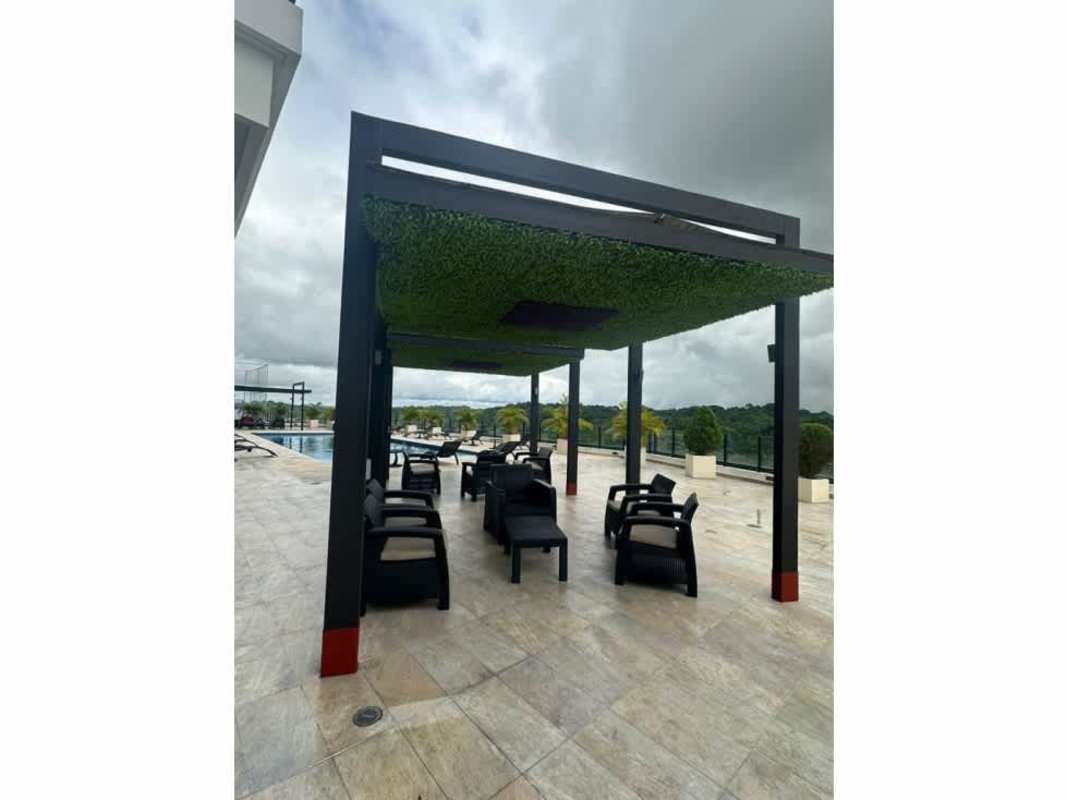 Contemporary kitchen with granite countertops dark cabinetry open shelves in PH Portofino Tower