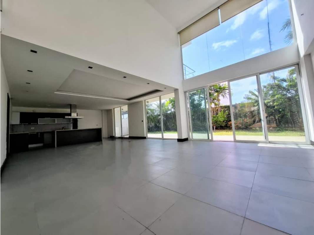 Spacious modern living area with large windows overlooking garden in PH Costa Esmeralda Panama