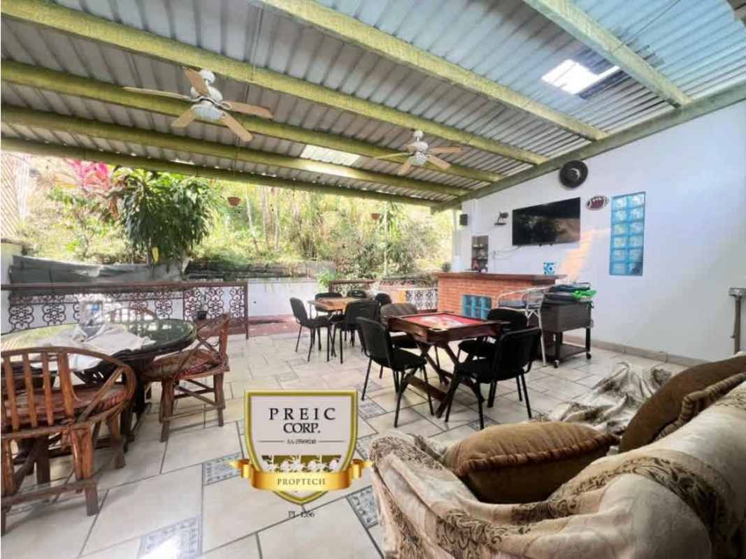 Large outdoor covered patio lounge with ceiling fans and dining area, house for rent Hato Pintado Panama