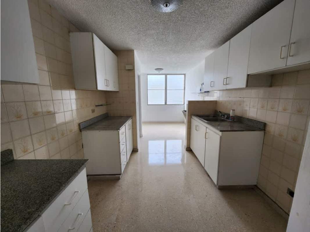 Open concept living-dining room with fans and large windows in PH Alameda Panama