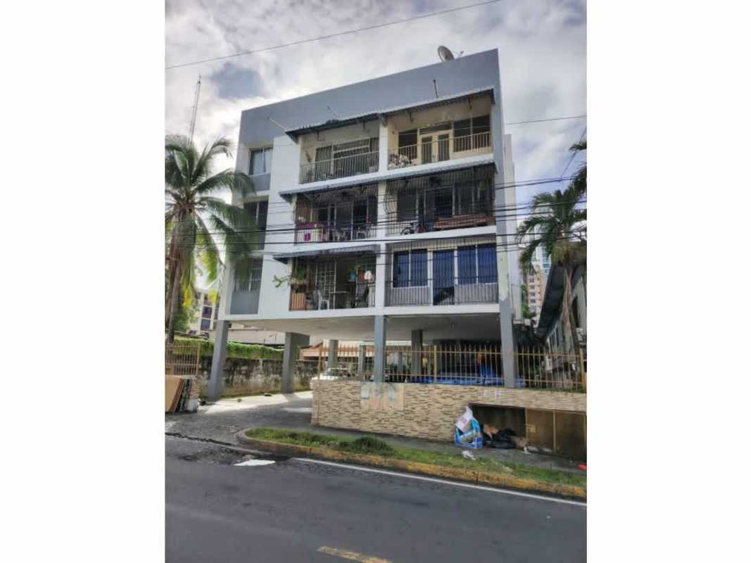 Bright living room with large windows and access to balcony at PH Las Palmas in San Francisco Panama City