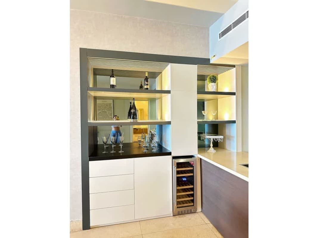 Upscale kitchen with granite island, built-in appliances at Yoo Panamá Arts Tower