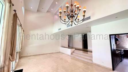 Elegant dining space with marble staircase in villa at Tucan Country Club Panama