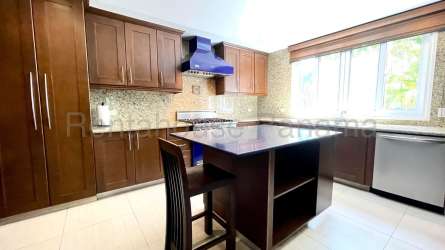 Spacious master bedroom with balcony and golf views in Tucan Golf Resort Panama