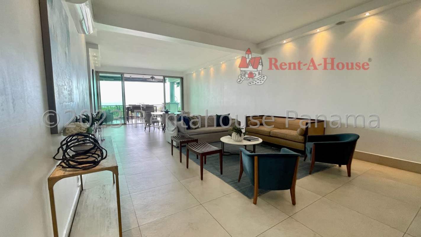 Bright spacious living room with large windows and canal views in PH Amador Marina Suites Panama City