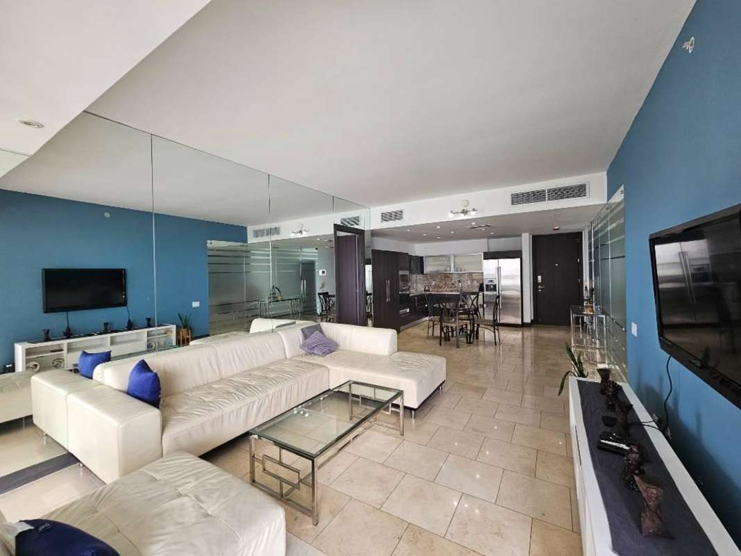 Modern open-plan living dining area with sea views Punta Pacífica JW Marriott