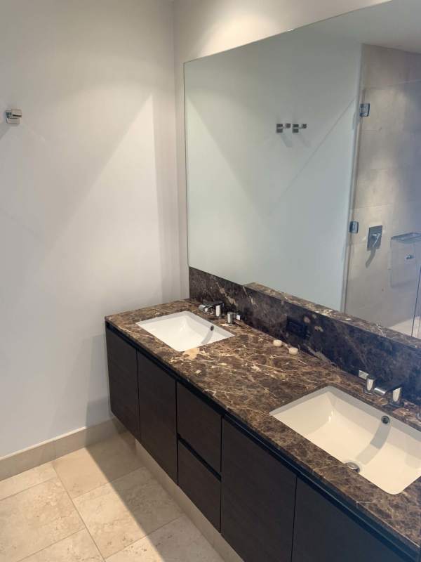 Marble bathroom with double sink vanity and glass shower in PH The Ocean Club Trump Tower Panama